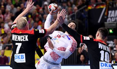 COLOGNE, GERMANY - JANUARY 21: Patrick Wiencek of Germany and Fabian Wieder of Germany challenge Igor Karacic of Croatia during the 26th IHF Men's World Championship group 1 match between Croatia and Germany at Lanxess Arena on January 21, 2019 in Cologne, Germany. (Photo by Jörg Schüler/Getty Images)